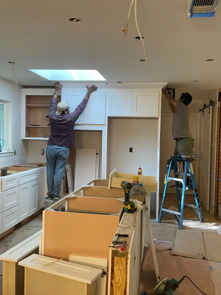During: crew installing new cabinets