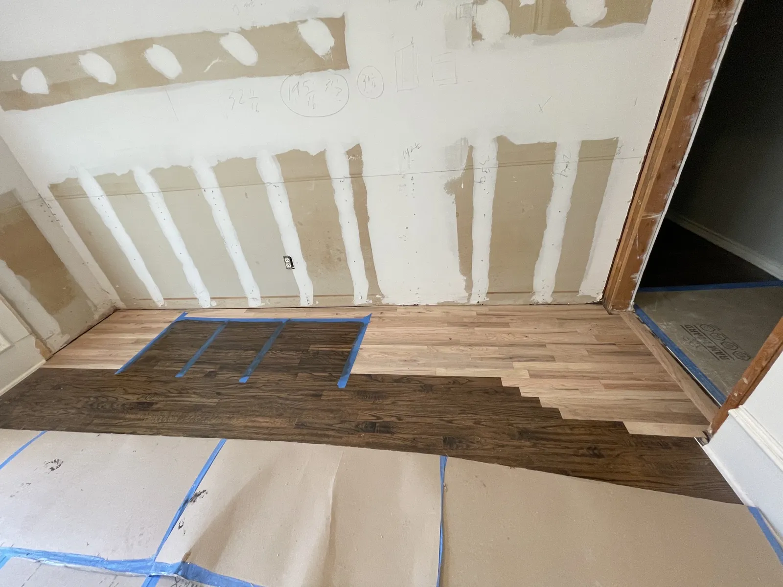 During: hardwood floor patched and stained at new doorway