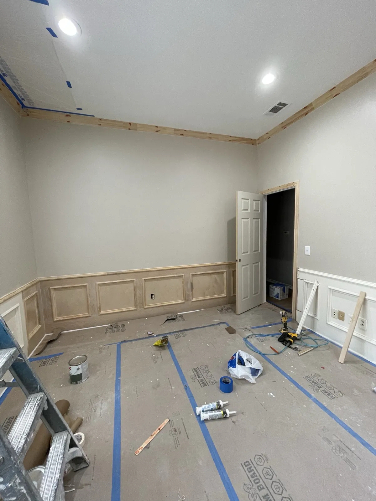 During: wainscot paneling before paint