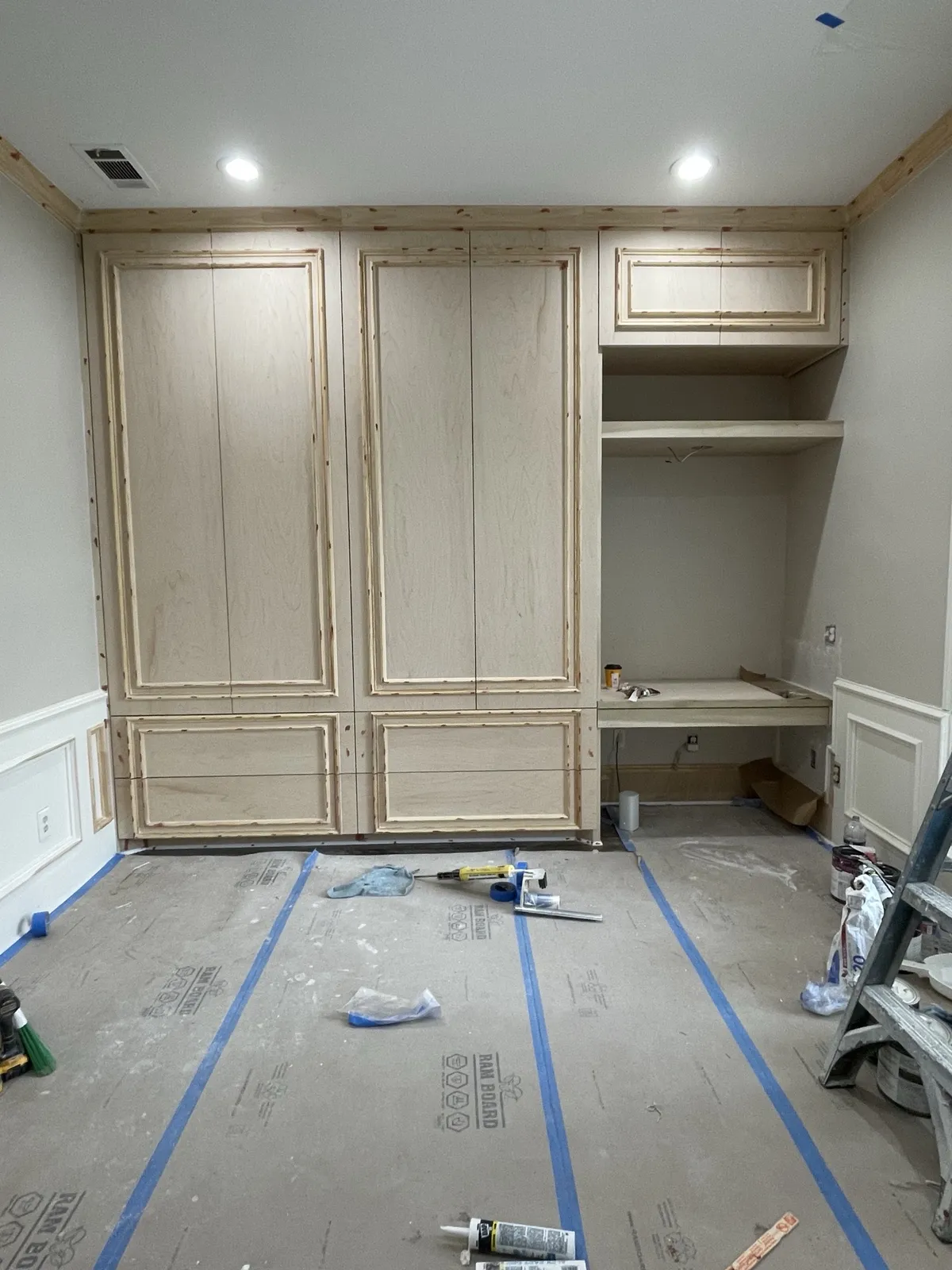 During: wardrobe doors and trim before paint
