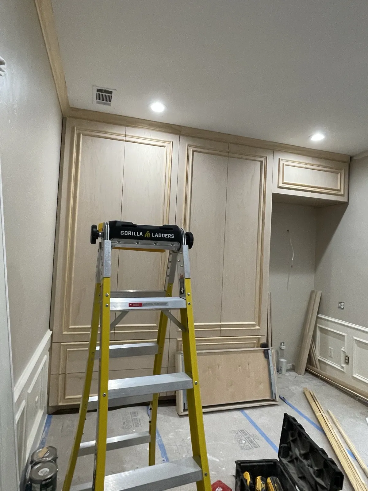 During: wardrobe doors hung before paint