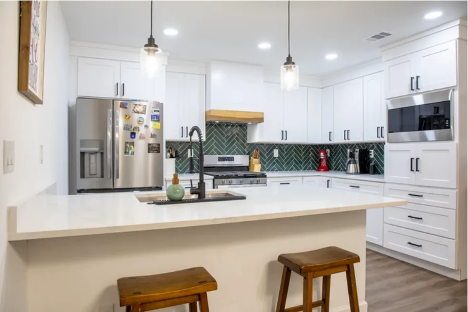 After: kitchen herringbone backsplash