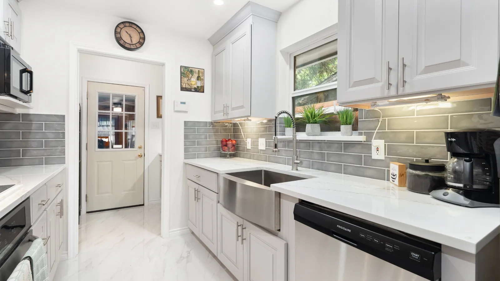 After: farmhouse sink and dishwasher