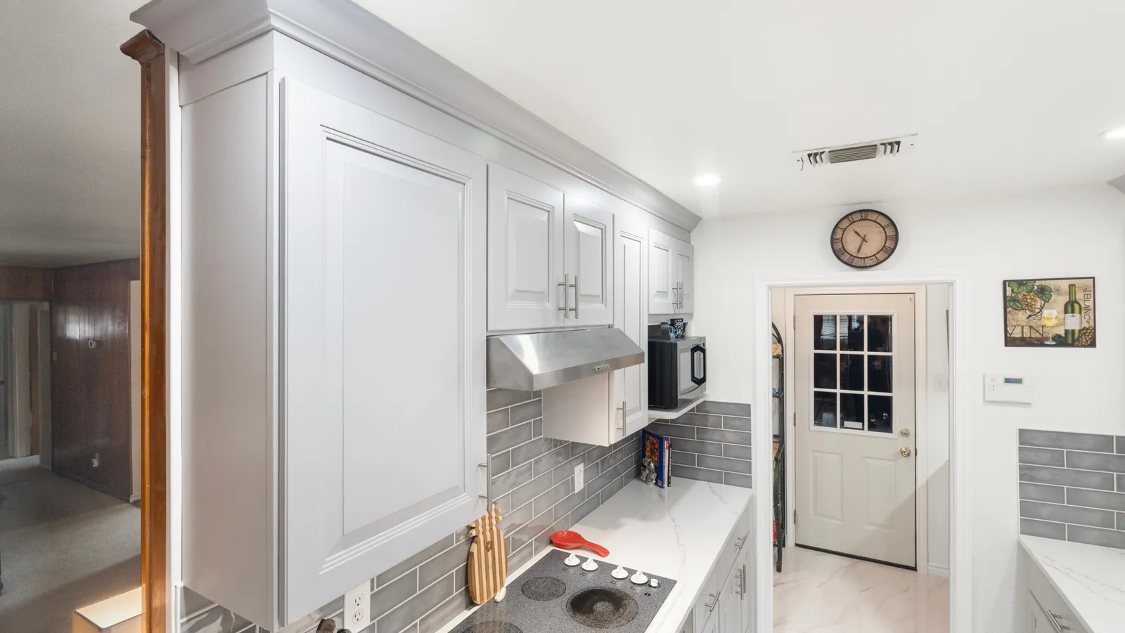 After: upper cabinets and range hood