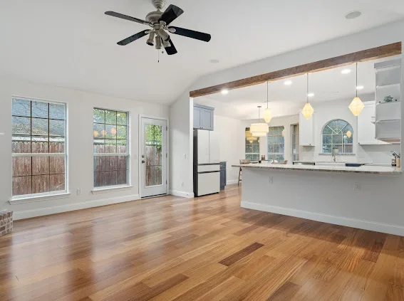 After: open living area and kitchen peninsula