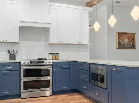 After: range wall with custom hood and subway tile backsplash