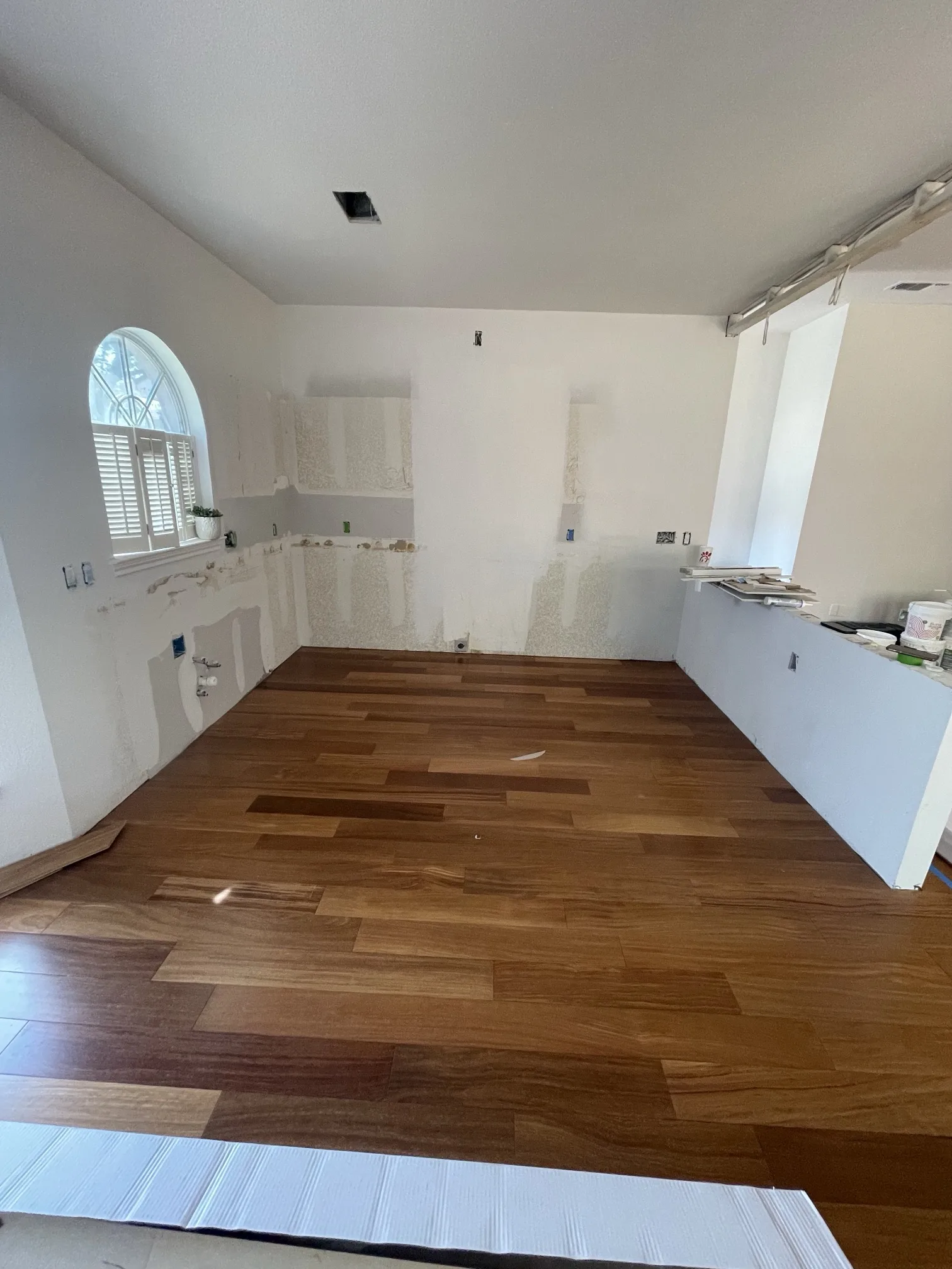 During: hardwood floor installed before cabinets