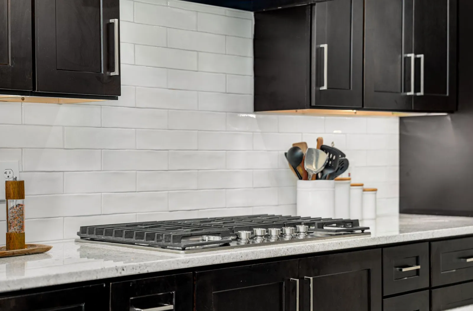 After: cooktop and tile backsplash closeup