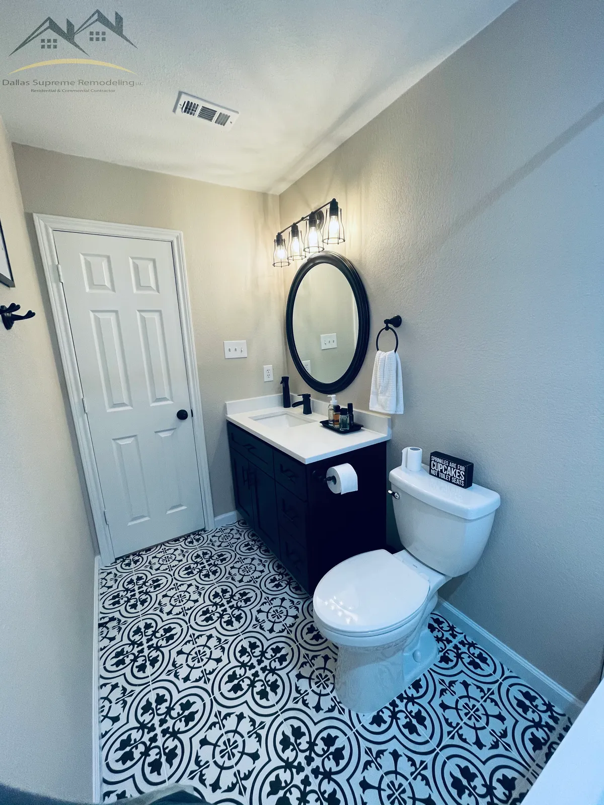 After: vanity oval mirror and patterned floor