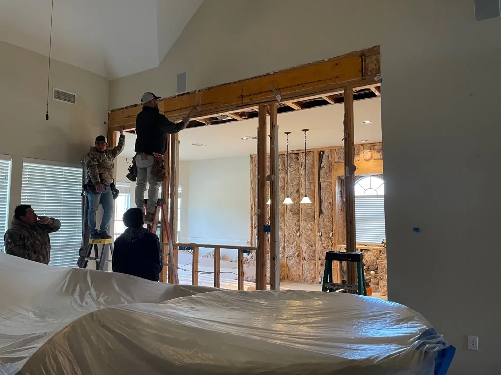During: crew working on opened wall